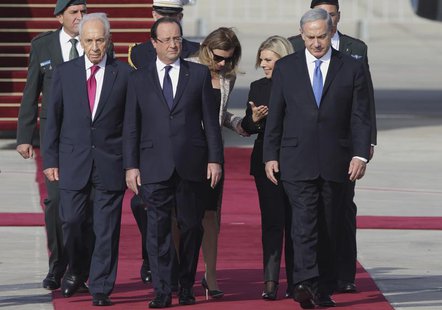 French President Francois Hollande (C) and his companion Valerie Trierweiler (3rd L) are welcomed by Israel's President Shimon Peres (L), Pr French President Francois Hollande (C) and his companion Valerie Trierweiler (3rd L) are welcomed by Israel's President Shimon Peres (L), Pr