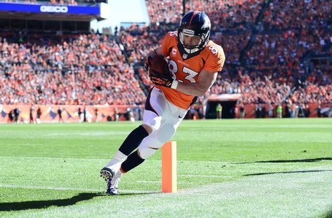 Oct 27, 2013; Denver, CO, USA;Denver Broncos wide receiver Wes Welker (83) scores a touchdown in the first quarter against the Washington Re Oct 27, 2013; Denver, CO, USA;Denver Broncos wide receiver Wes Welker (83) scores a touchdown in the first quarter against the Washington Re