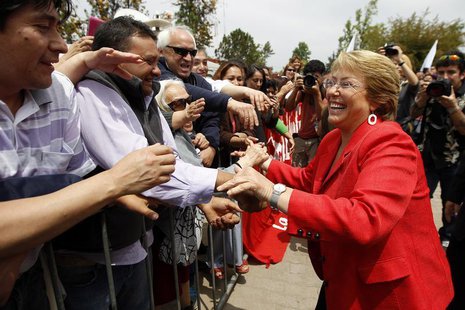 Chilean presidential candidate Michelle Bachelet greets supporters during a campaign event in Santiago November 18, 2013. REUTERS/Ivan Alvar Chilean presidential candidate Michelle Bachelet greets supporters during a campaign event in Santiago November 18, 2013. REUTERS/Ivan Alvar