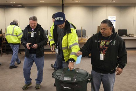 Union members cast their ballots at the International Association of Machinists District 751 Headquarters during a union vote in Seattle, Wa Union members cast their ballots at the International Association of Machinists District 751 Headquarters during a union vote in Seattle, Wa