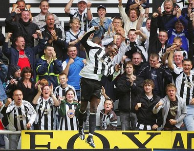 Newcastle United's Shola Ameobi (C) celebrates scoring the winning goal against Wigan Athletic during their English Premier League soccer ma Newcastle United's Shola Ameobi (C) celebrates scoring the winning goal against Wigan Athletic during their English Premier League soccer ma