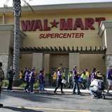 Walmart workers on strike walk a picket line during a protest over unsafe working conditions and poor wages outside a Walmart store in Pico Walmart workers on strike walk a picket line during a protest over unsafe working conditions and poor wages outside a Walmart store in Pico
