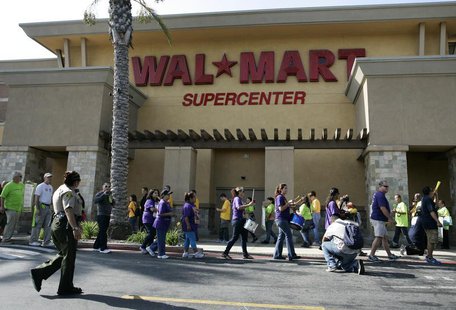 Walmart workers on strike walk a picket line during a protest over unsafe working conditions and poor wages outside a Walmart store in Pico Walmart workers on strike walk a picket line during a protest over unsafe working conditions and poor wages outside a Walmart store in Pico