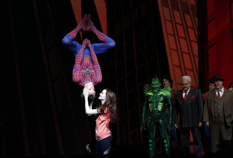 Cast member Reeve Carney (L) is kissed by fellow cast member Jennifer Damiano (C) during the curtain call for the Broadway opening of "Spide Cast member Reeve Carney (L) is kissed by fellow cast member Jennifer Damiano (C) during the curtain call for the Broadway opening of "Spide