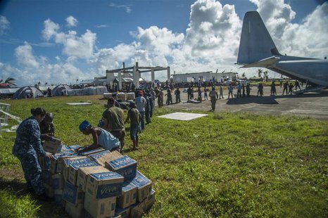 Sailors assigned to the aircraft carrier USS George Washington (CVN 73), marines from the 3d Marine Expeditionary Brigade (3d MEB), and Phil Sailors assigned to the aircraft carrier USS George Washington (CVN 73), marines from the 3d Marine Expeditionary Brigade (3d MEB), and Phil