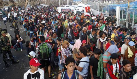 Typhoon Haiyan victims queue outside Tacloban airport for a C-130 military mercy flight to Manila, in Tacloban, central Philippines November Typhoon Haiyan victims queue outside Tacloban airport for a C-130 military mercy flight to Manila, in Tacloban, central Philippines November