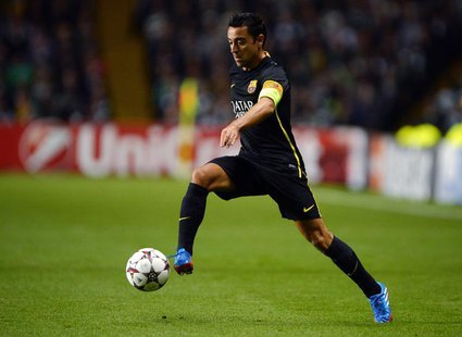 Barcelona's Xavi Hernandez runs with the ball during their Champions League soccer match against Celtic at Celtic Park in Glasgow, October 1 Barcelona's Xavi Hernandez runs with the ball during their Champions League soccer match against Celtic at Celtic Park in Glasgow, October 1
