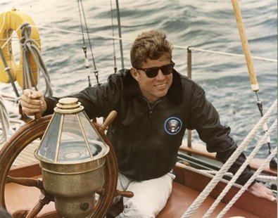 Former United States President John F. Kennedy sits onboard the U.S. Coast Guard yacht Manitou off the coast of Maine, in this handout image Former United States President John F. Kennedy sits onboard the U.S. Coast Guard yacht Manitou off the coast of Maine, in this handout image