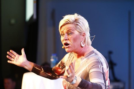 Siv Jensen, leader of Norway's Fremskrittspartiet (Progress party), speaks to party members while waiting for the result of the general elec Siv Jensen, leader of Norway's Fremskrittspartiet (Progress party), speaks to party members while waiting for the result of the general elec