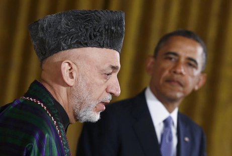 Afghan President Hamid Karzai (L) addresses a joint news conference with U.S. President Barack Obama in the East Room of the White House in Afghan President Hamid Karzai (L) addresses a joint news conference with U.S. President Barack Obama in the East Room of the White House in