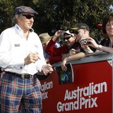 Former Formula One champion driver Jackie Stewart of Britain signs autographs as he arrives at the Albert Park circuit for the third practic Former Formula One champion driver Jackie Stewart of Britain signs autographs as he arrives at the Albert Park circuit for the third practic