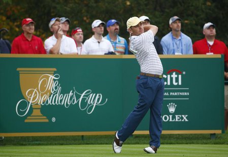 International team member Louis Oosthuizen of South Africa tees off on the 16th hole during the continuation of his rain-delayed foursome ma International team member Louis Oosthuizen of South Africa tees off on the 16th hole during the continuation of his rain-delayed foursome ma