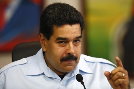 Venezuela's President Nicolas Maduro gestures during a news conference at Miraflores Palace in Caracas, November 15, 2013. REUTERS/Jorge Sil Venezuela's President Nicolas Maduro gestures during a news conference at Miraflores Palace in Caracas, November 15, 2013. REUTERS/Jorge Sil
