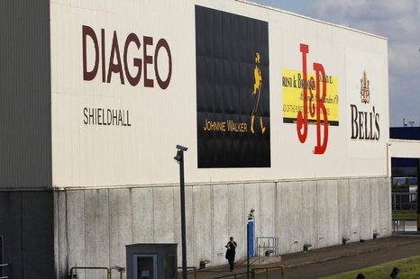 A man walks past a building in the Diageo Shieldhall facility near Glasgow, Scotland August 26, 2010. REUTERS/David Moir A man walks past a building in the Diageo Shieldhall facility near Glasgow, Scotland August 26, 2010. REUTERS/David Moir