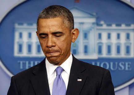 U.S. President Barack Obama pauses while he talks about the Affordable Care Act in the Brady Press Briefing Room at the White House in Washi U.S. President Barack Obama pauses while he talks about the Affordable Care Act in the Brady Press Briefing Room at the White House in Washi