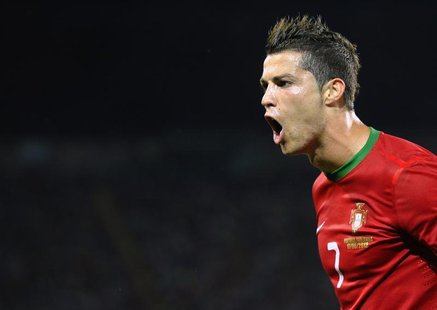 Portugal's Cristiano Ronaldo celebrates after scoring a goal against Netherlands during their Group B Euro 2012 soccer match at the Metalist Portugal's Cristiano Ronaldo celebrates after scoring a goal against Netherlands during their Group B Euro 2012 soccer match at the Metalist