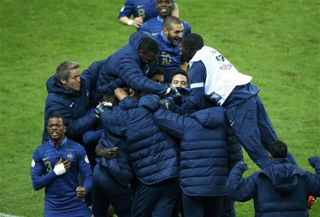 France's soccer team players celebrate after Ukraine's Oleg Guslev (unseen) scored an own goal during their 2014 World Cup qualifying second France's soccer team players celebrate after Ukraine's Oleg Guslev (unseen) scored an own goal during their 2014 World Cup qualifying second