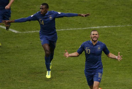 France's Karim Benzema celebrates with teammates after scoring the second goal for the team during their 2014 World Cup qualifying second le France's Karim Benzema celebrates with teammates after scoring the second goal for the team during their 2014 World Cup qualifying second le