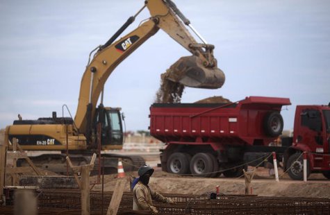 A worker is pictured at the construction site of Port of Acu in Sao Joao da Barra March 11, 2013. REUTERS/Ricardo Moraes A worker is pictured at the construction site of Port of Acu in Sao Joao da Barra March 11, 2013. REUTERS/Ricardo Moraes