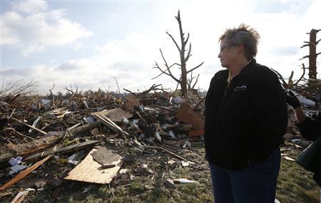 Pat Nelson looks out over the debris and destruction caused by a tornado that touched down in Washington, Illinois, November 18, 2013.
CREDIT: REUTERS/JIM YOUNG Pat Nelson looks out over the debris and destruction caused by a tornado that touched down in Washington, Illinois, November 18, 2013.
CREDIT: REUTERS/JIM YOUNG
