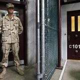 In this photo, reviewed by the U.S. military, a Guantanamo guard stands inside a doorway at Camp 6 detention facility at Guantanamo Bay U.S. In this photo, reviewed by the U.S. military, a Guantanamo guard stands inside a doorway at Camp 6 detention facility at Guantanamo Bay U.S.