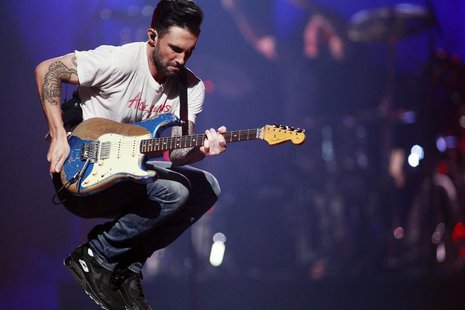 Maroon 5 lead singer Adam Levine jumps as they perform during the iHeartRadio Music Festival in Las Vegas, Nevada September 21, 2013. REUTER Maroon 5 lead singer Adam Levine jumps as they perform during the iHeartRadio Music Festival in Las Vegas, Nevada September 21, 2013. REUTER