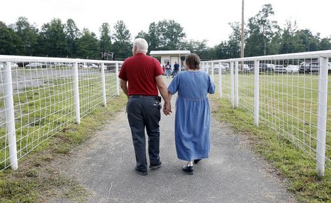 A couple leaves the Remote Area Medical (RAM) health clinic at the Wise County Fairgrounds in Wise, Virginia July 24, 2009. REUTERS/Shannon A couple leaves the Remote Area Medical (RAM) health clinic at the Wise County Fairgrounds in Wise, Virginia July 24, 2009. REUTERS/Shannon