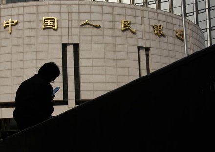 A man sits in front of the headquarters of the People's Bank of China, the central bank, in Beijing October 17, 2013. REUTERS/Kim Kyung-Hoon A man sits in front of the headquarters of the People's Bank of China, the central bank, in Beijing October 17, 2013. REUTERS/Kim Kyung-Hoon
