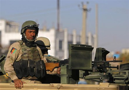 Afghan policemen keep watch at the area where the Loya Jirga will take place later this week, in Kabul November 19, 2013. Thousands of Afgha Afghan policemen keep watch at the area where the Loya Jirga will take place later this week, in Kabul November 19, 2013. Thousands of Afgha