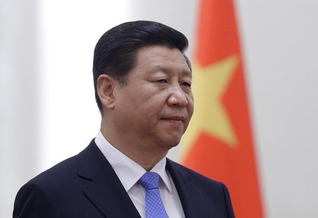 China's President Xi Jinping stands next to a Chinese national flag during a welcoming ceremony at the Great Hall of the People, in Beijing, China's President Xi Jinping stands next to a Chinese national flag during a welcoming ceremony at the Great Hall of the People, in Beijing,
