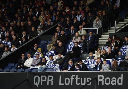 Queens Park Rangers' fans watch their team take on Newcastle United during their English Premier League soccer match at Loftus Road in Londo Queens Park Rangers' fans watch their team take on Newcastle United during their English Premier League soccer match at Loftus Road in Londo