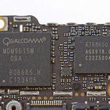 Handout image released by iFixit.com shows the Qualcomm MDM9615M chip on a board of a new iPhone 5 in Melbourne, Australia September 21, 201 Handout image released by iFixit.com shows the Qualcomm MDM9615M chip on a board of a new iPhone 5 in Melbourne, Australia September 21, 201
