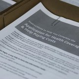 Paper applications are available in lieu of using the HealthCare.gov website at a health care enrolment fair co-sponsored by Planned Parenth Paper applications are available in lieu of using the HealthCare.gov website at a health care enrolment fair co-sponsored by Planned Parenth