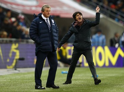 Germany's coach Joachim Loew (R) celebrates nex to England's manager Roy Hodgson after their international friendly soccer match at Wembley Germany's coach Joachim Loew (R) celebrates nex to England's manager Roy Hodgson after their international friendly soccer match at Wembley