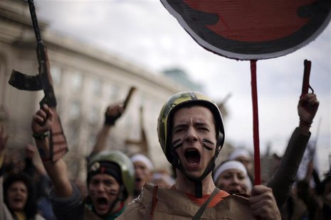 Protesting students wearing fake military uniforms shout anti-government slogans during a demonstration in front of Sofia University Novembe Protesting students wearing fake military uniforms shout anti-government slogans during a demonstration in front of Sofia University Novembe