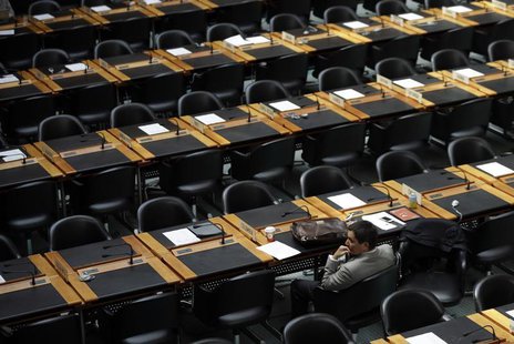 A delegate waits for the opening of a session of the Trade Negotiation Committee at the World Trade Organization (WTO) in Geneva July 22, 20 A delegate waits for the opening of a session of the Trade Negotiation Committee at the World Trade Organization (WTO) in Geneva July 22, 20