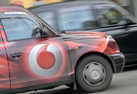 Vodafone branding is seen on the side of a London taxi in London November 12, 2013. REUTERS/Toby Melville Vodafone branding is seen on the side of a London taxi in London November 12, 2013. REUTERS/Toby Melville