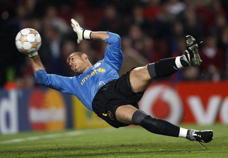 Barcelona's goalkeeper Victor Valdes blocks a ball against Schalke 04 during their Champions League quarter-final second leg soccer match at Barcelona's goalkeeper Victor Valdes blocks a ball against Schalke 04 during their Champions League quarter-final second leg soccer match at