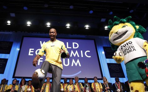 Former South Africa and Leeds United soccer player Lucas Radebe kicks a ball as he is joined by Zakumi, the 2010 World Cup official mascot d Former South Africa and Leeds United soccer player Lucas Radebe kicks a ball as he is joined by Zakumi, the 2010 World Cup official mascot d