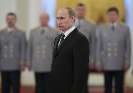 Russia's President Vladimir Putin attends a ceremony to present officers, who were recently appointed to senior command positions, at the Kr Russia's President Vladimir Putin attends a ceremony to present officers, who were recently appointed to senior command positions, at the Kr