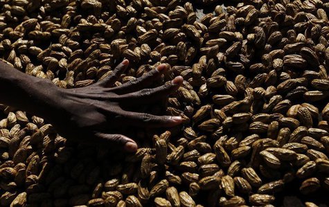 A woman arranges peanuts at the main markets in Honiara September 14, 2012. REUTERS/Daniel Munoz A woman arranges peanuts at the main markets in Honiara September 14, 2012. REUTERS/Daniel Munoz