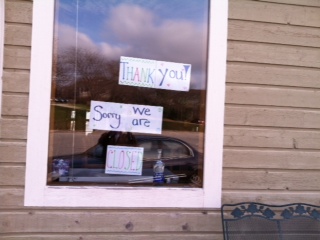 Signs posted on a Brisco County window indicating their sudden closure. Signs posted on a Brisco County window indicating their sudden closure.