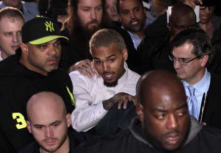 Rapper Chris Brown (C) leaves the U.S. District Court in Washington October 28, 2013. REUTERS/Yuri Gripas Rapper Chris Brown (C) leaves the U.S. District Court in Washington October 28, 2013. REUTERS/Yuri Gripas