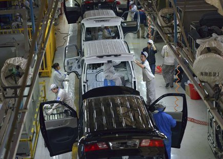 Employees work inside a factory manufacturing automobiles in Shenyang, Liaoning province, November 9, 2013. REUTERS/Stringer Employees work inside a factory manufacturing automobiles in Shenyang, Liaoning province, November 9, 2013. REUTERS/Stringer