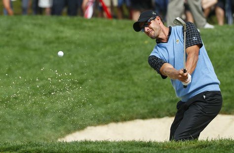 Adam Scott of Australia hits from the sand on the 14th hole during his match against Bill Haas of the U.S. during the Singles matches for th Adam Scott of Australia hits from the sand on the 14th hole during his match against Bill Haas of the U.S. during the Singles matches for th