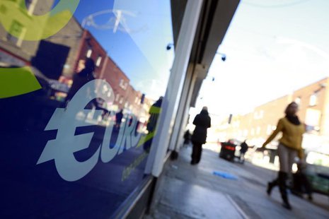 People walk past a discount store in the Moore Street area of Dublin November 7, 2013. REUTERS/Cathal McNaughton People walk past a discount store in the Moore Street area of Dublin November 7, 2013. REUTERS/Cathal McNaughton