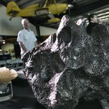 Meteorites sit on a display table at the Deep Space Industries announcement of plans for the world's first fleet of commercial asteroid-pros Meteorites sit on a display table at the Deep Space Industries announcement of plans for the world's first fleet of commercial asteroid-pros