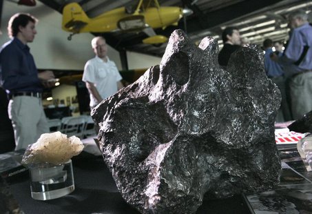 Meteorites sit on a display table at the Deep Space Industries announcement of plans for the world's first fleet of commercial asteroid-pros Meteorites sit on a display table at the Deep Space Industries announcement of plans for the world's first fleet of commercial asteroid-pros