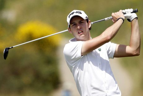 Matthew Nixon of Britain watches his approach shot on the third hole during the French Open golf tournament at the Golf National course in S Matthew Nixon of Britain watches his approach shot on the third hole during the French Open golf tournament at the Golf National course in S