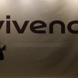 A woman holding a young girl in her arms is silhouetted as she walks past the main entrance of the entertainment-to-telecoms conglomerate Vi A woman holding a young girl in her arms is silhouetted as she walks past the main entrance of the entertainment-to-telecoms conglomerate Vi